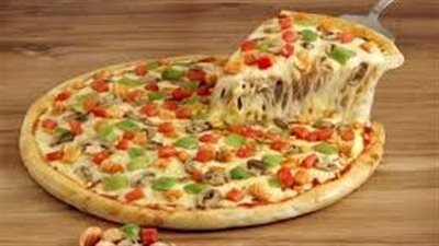 طريقة عمل عجينة البيتزا.. سر الطعم الإيطالي في مطبخك